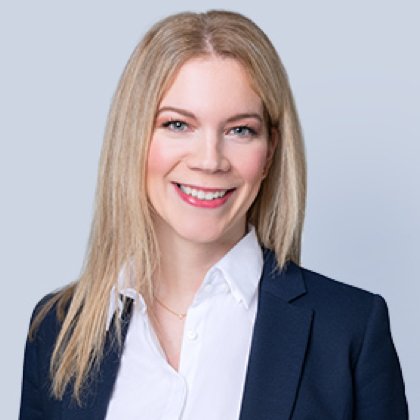 woman in suit smiling