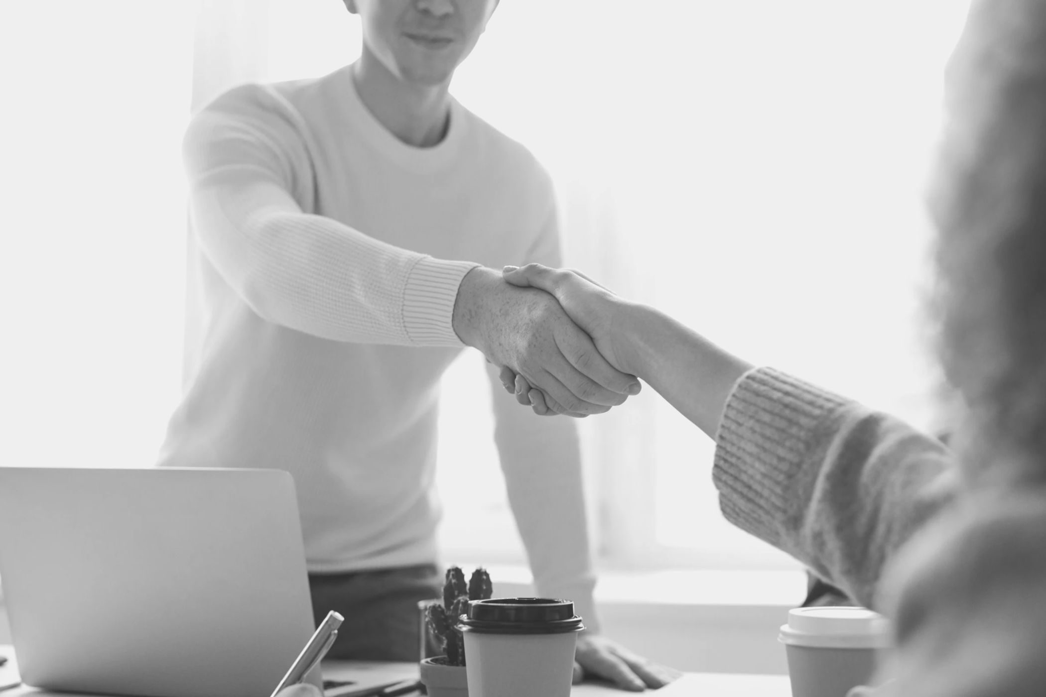 man and woman shaking hands