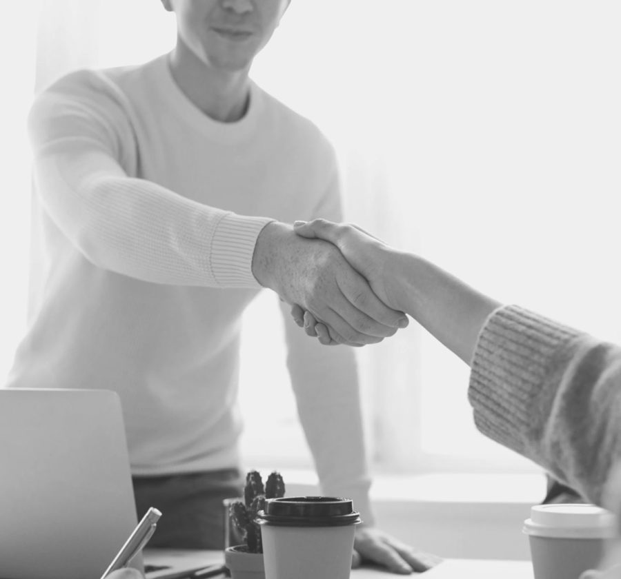 man and woman shaking hands